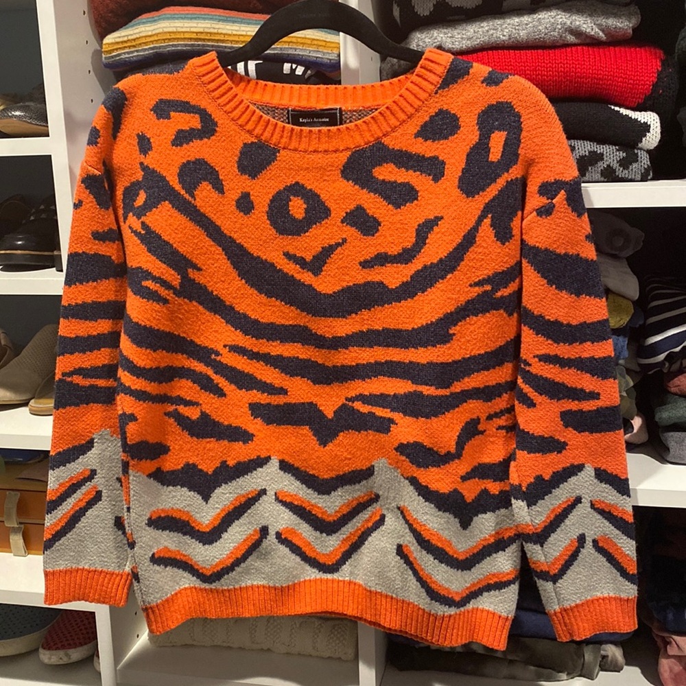 Kayla’s Armoire orange animal print sweater